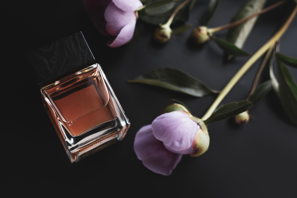 perfume bottle and pink flowers
